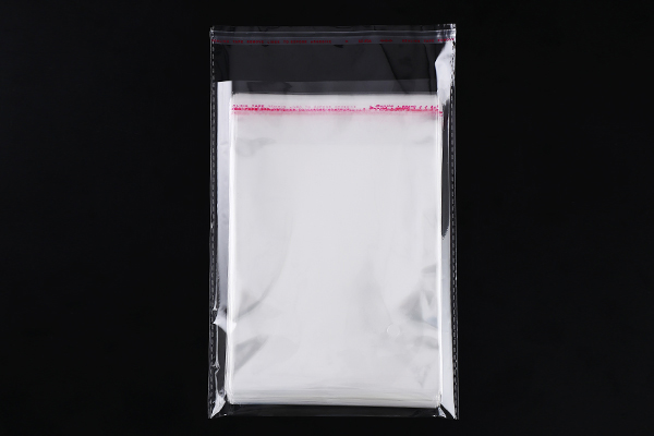 How do the tear-off and self-adhesive strip of OPP Self-Adhesive Bag improve the convenience of use?